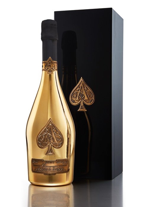 Armand De Brignac Brut Gold Champagne bottle with ornate spade logo and black foil neck
