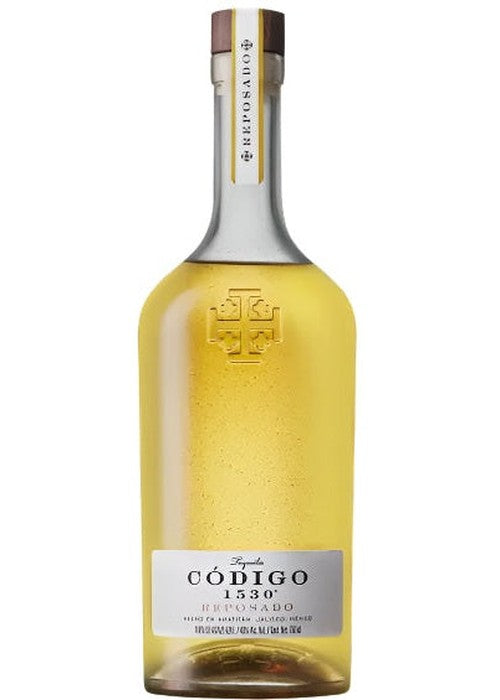 Codigo 1530 Reposado tequila bottle with gold liquid and silver label