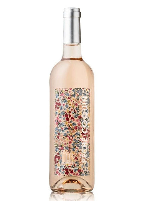 Peche Coquin Rosé wine bottle with floral label and pale salmon-pink hue