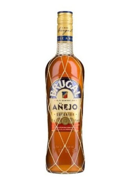 Brugal Anejo Superior rum bottle with diamond netting and amber liquid
