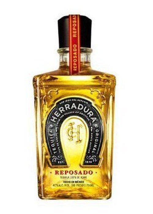 Herradura Reposado 700ml tequila bottle with copper liquid and black horseshoe label