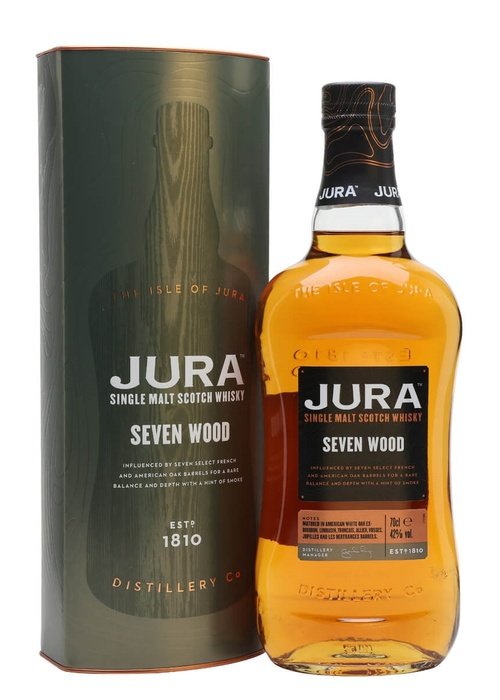 Jura Seven Wood 700ml single malt Scotch whisky bottle with black label and gold cap beside dark green wood grain tube packaging