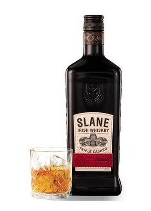 Slane Triple Casked Irish Whiskey 700ml bottle with amber liquid in glass