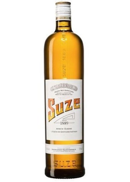 Suze 700ml amber gentian aperitif liqueur bottle with silver foil cap and vintage label